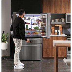 man opening ge profile refrigerator